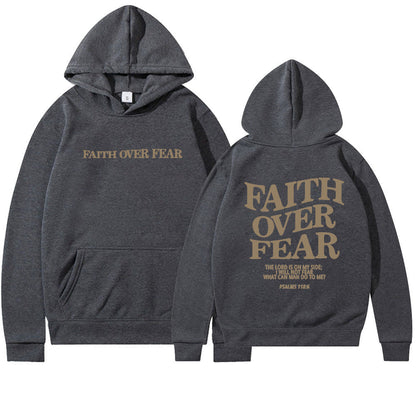 Two dark gray Faith Over Fear Christian Hoodies with hoods up, featuring gold lettering and a Psalms 118:6 Bible verse. This trendy unisex sweatshirt is perfect for daily encouragement and Christian inspiration.