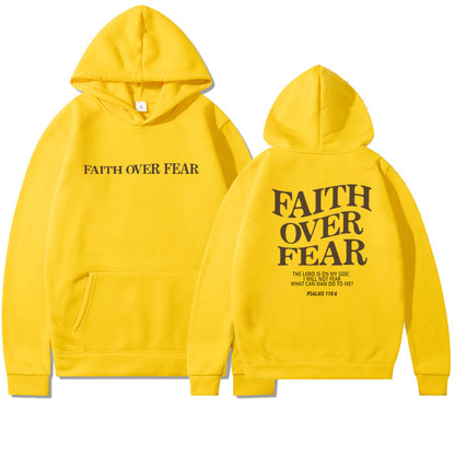 The Faith Over Fear Christian Hoodie features "FAITH OVER FEAR" on the front and the phrase with a Bible verse (Psalms 118:6) on the back. Trendy unisex Bible verse sweatshirt, perfect for inspiration and everyday wear.